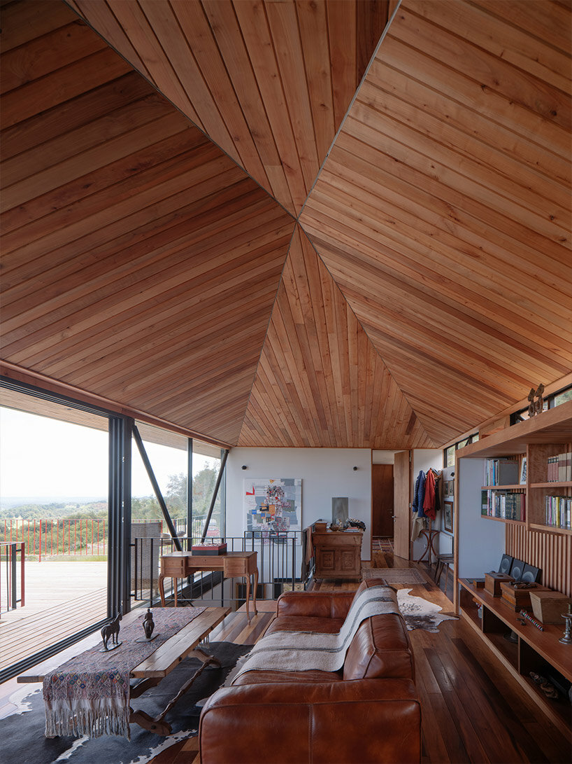 elongated 'la empastada house' frames sweeping vistas of rural chile