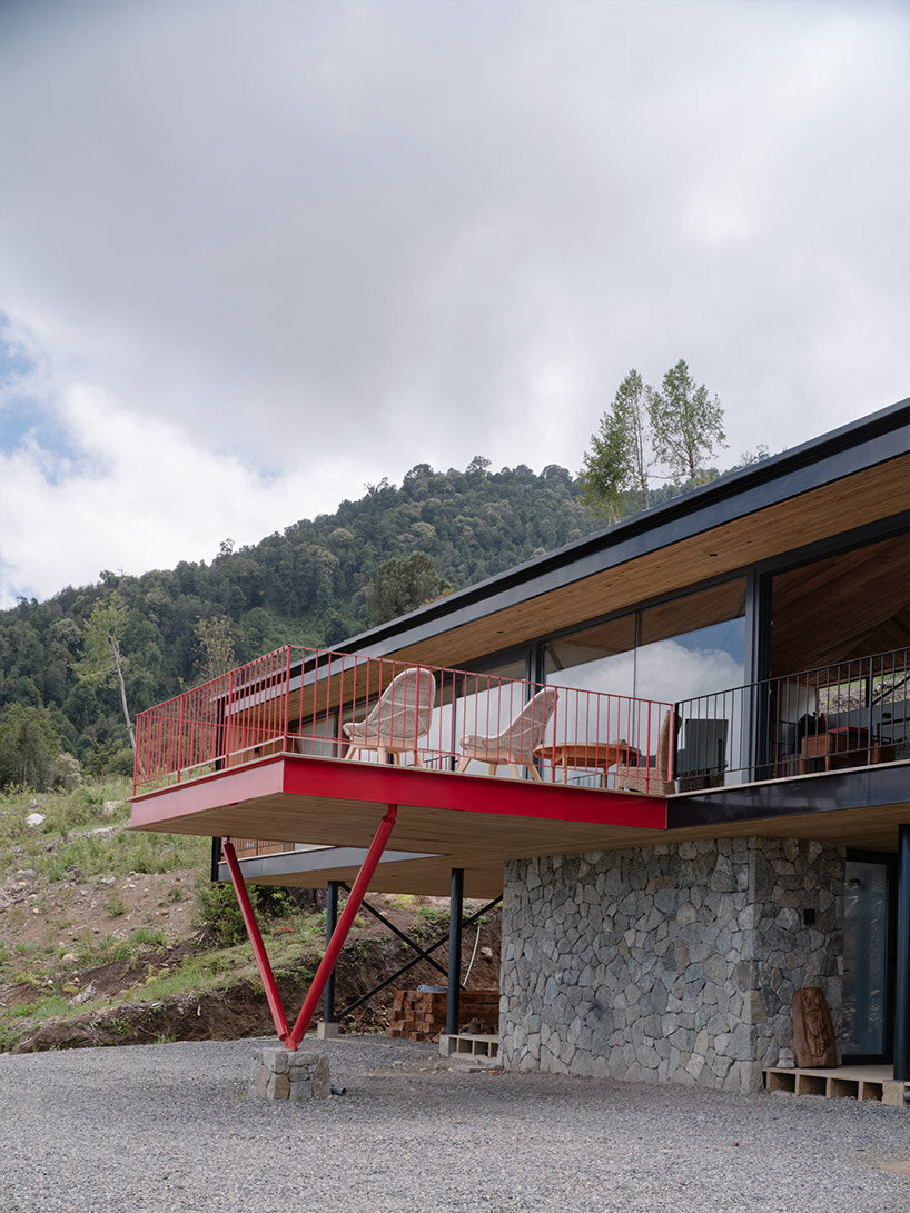 elongated 'la empastada house' frames sweeping vistas of rural chile