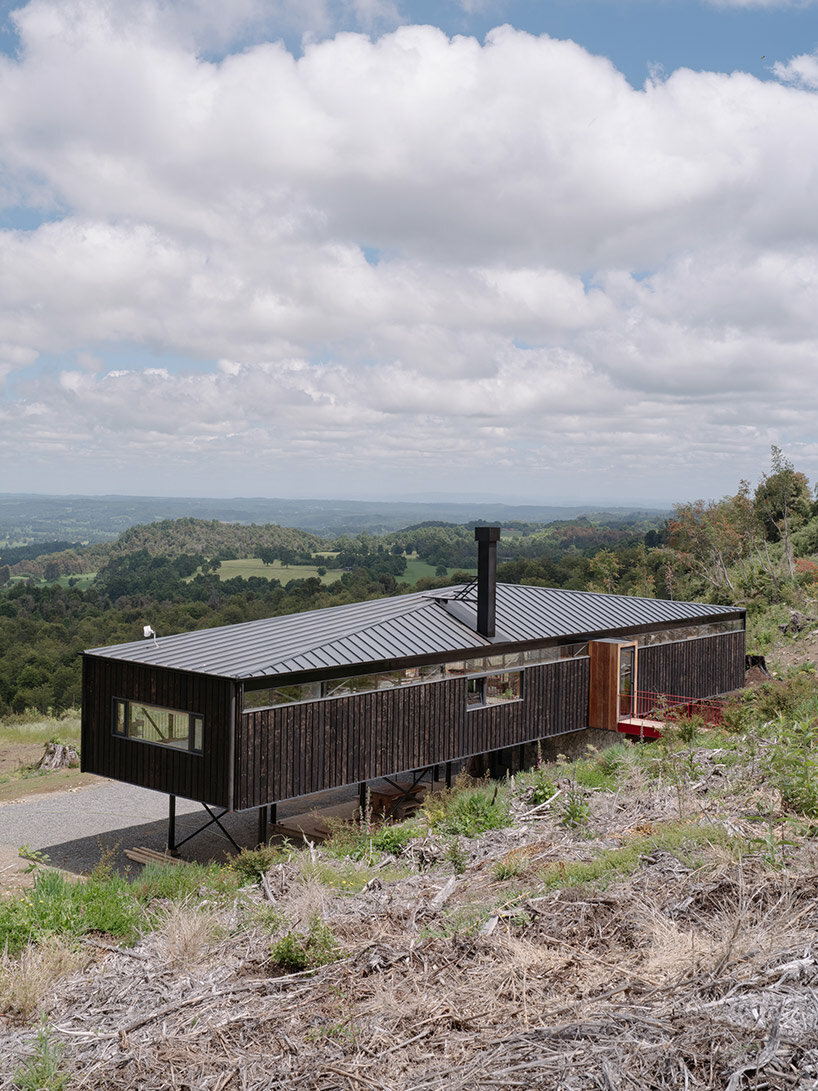 elongated 'la empastada house' frames sweeping vistas of rural chile