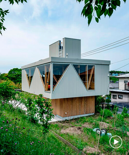 angular apertures cut through the wooden cantilever of residence in japan