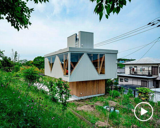 angular apertures cut through the wooden cantilever of residence in japan