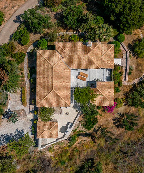 mediterranean summer hacienda unwraps on an olive grove hill in greece