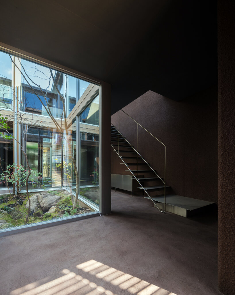 house in nakamachi plays with sunlight through reversible and sliding wooden shutters