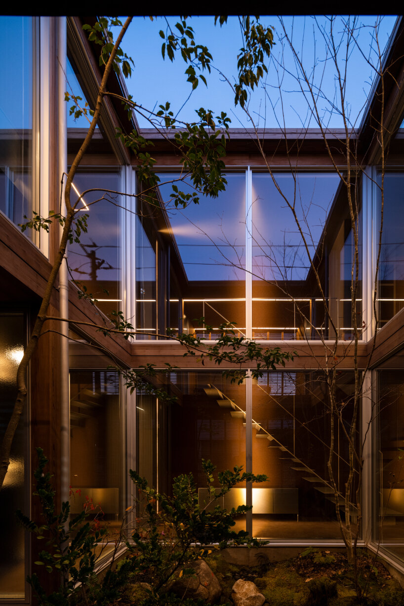 house in nakamachi plays with sunlight through reversible and sliding wooden shutters