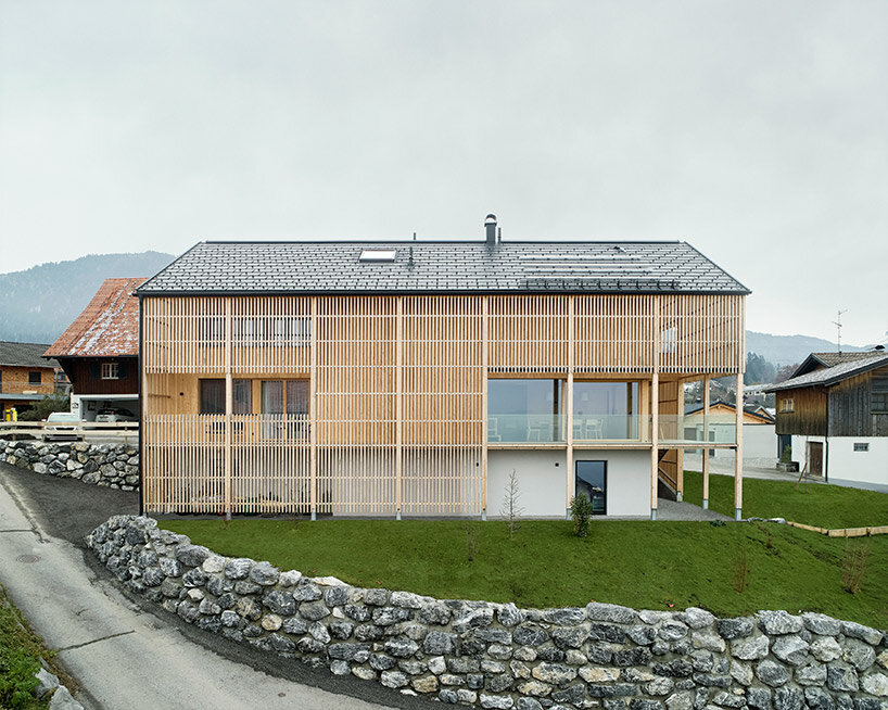 permeable facade encloses 'multigenerational house' in austria