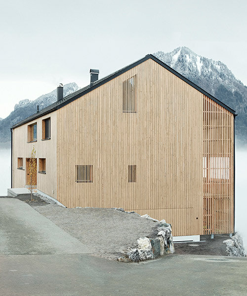 slender wooden slabs enclose permeable facade for 'multigenerational house' in rural austria