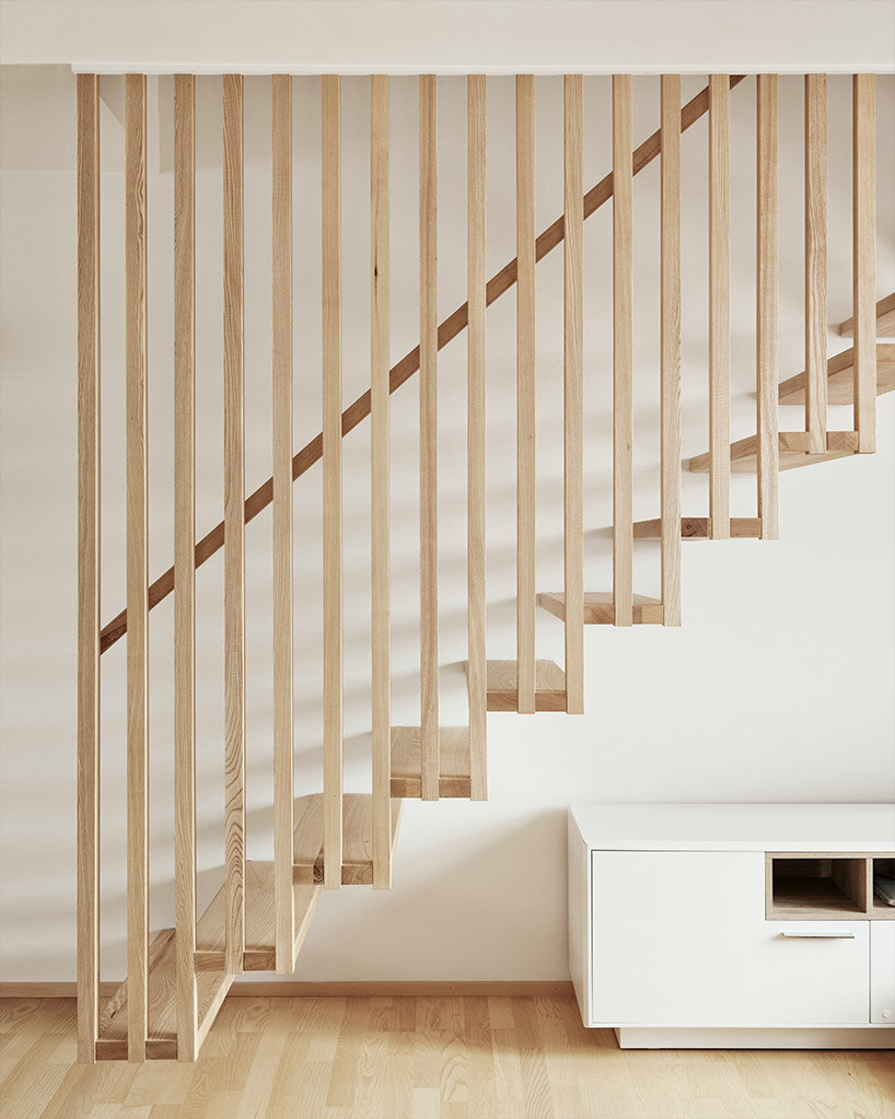 slender wooden slabs enclose permeable facade for 'multigenerational house' in rural austria