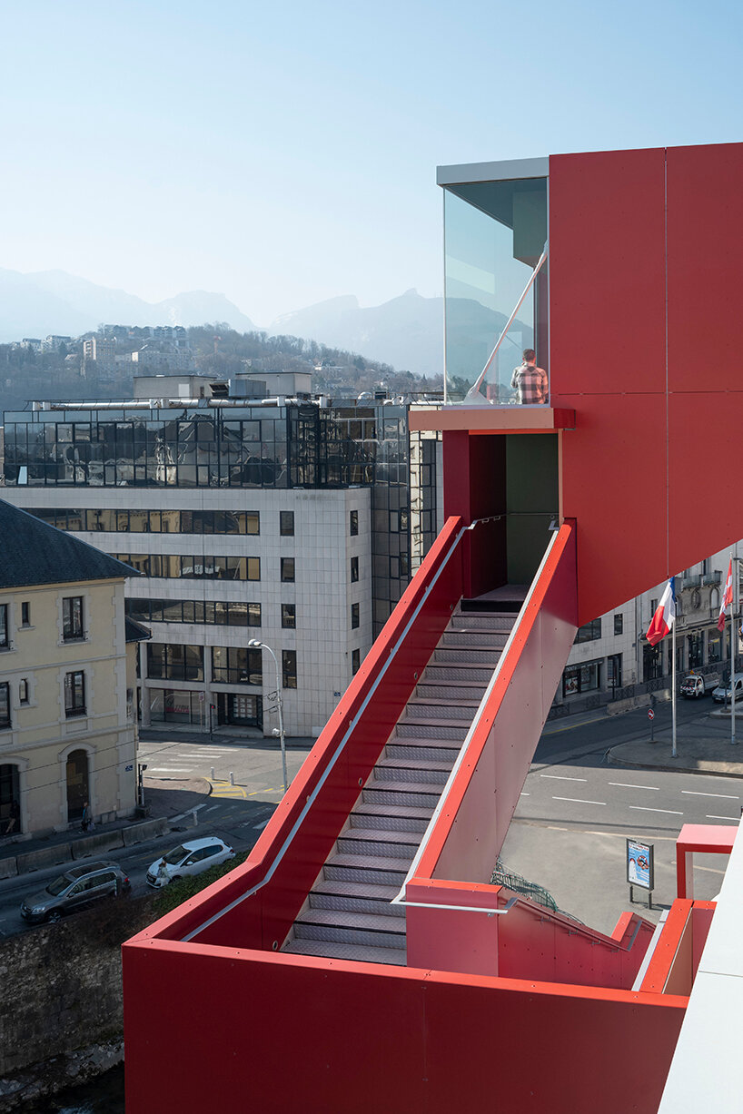 cantilevering red belvedere adorns new parking complex in chambéry, france