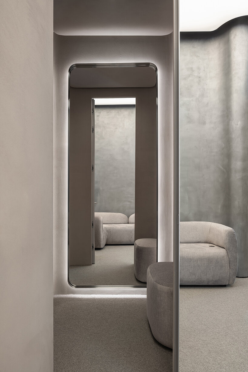 curving walls & interactive fitting rooms define this digital showroom by balbek bureau