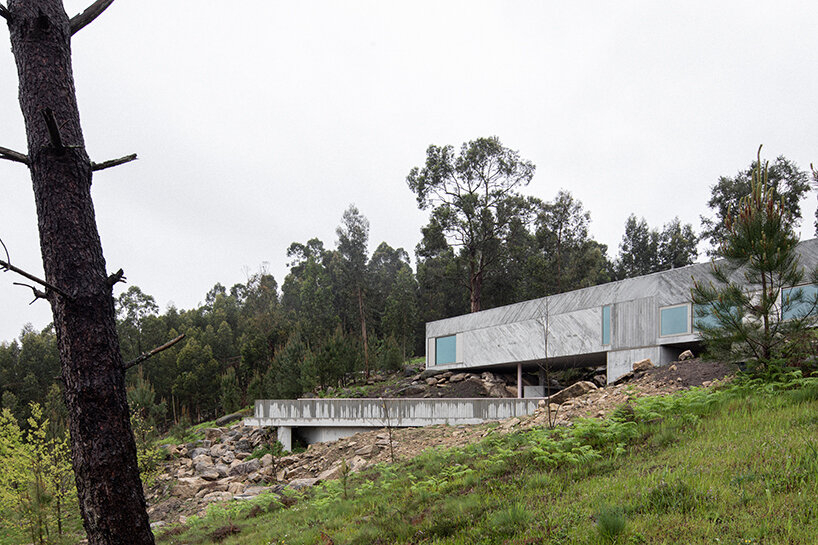 'tâmega' is a sculptural concrete home stretching horizontally across rugged land in portugal