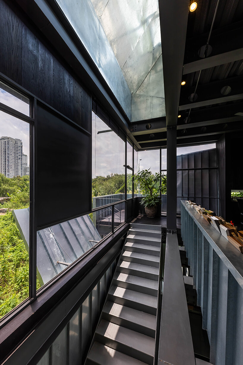 seemingly built from scraps, aaaaaa's office on stilts embraces the vietnamese climate