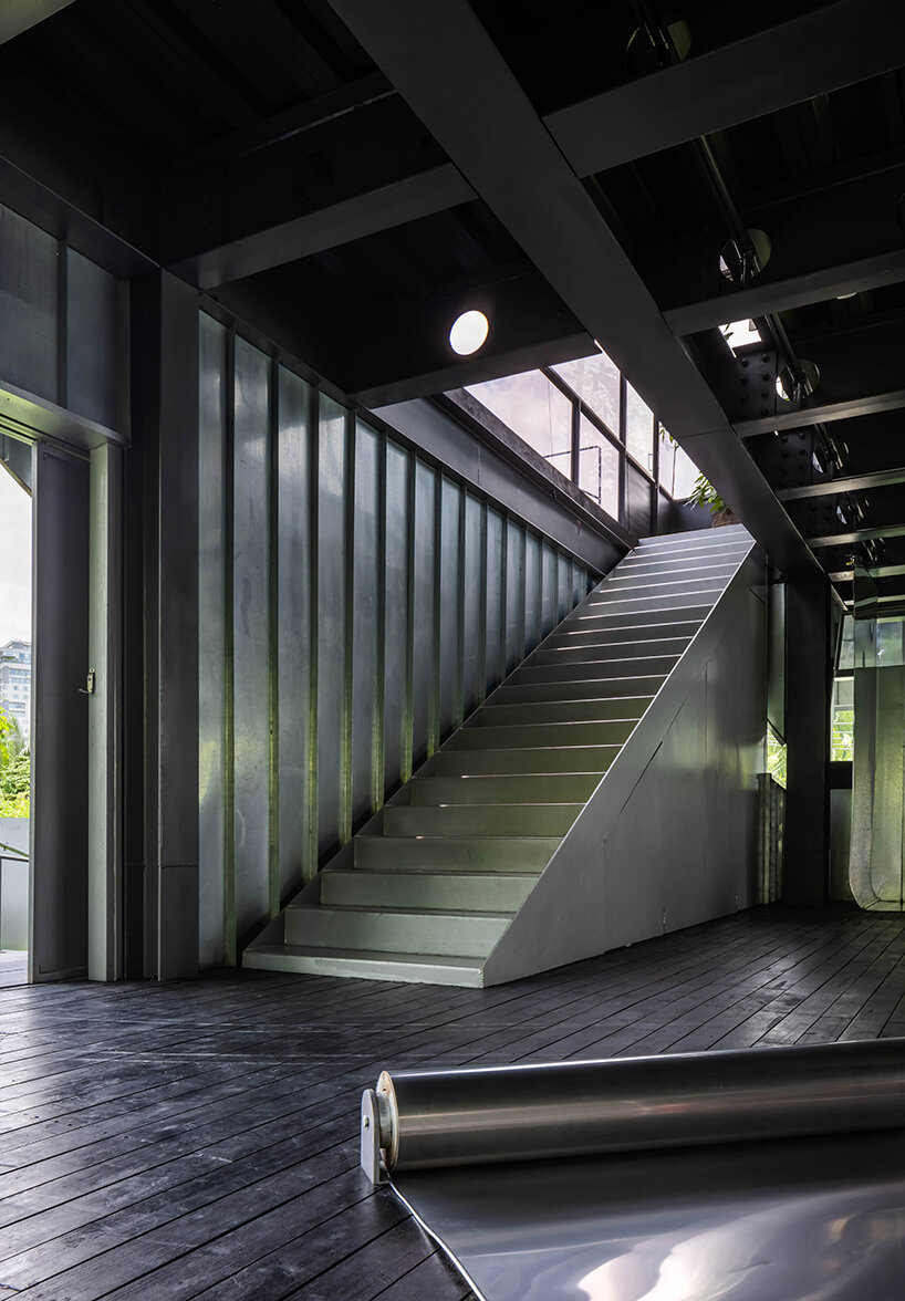 seemingly built from scraps, aaaaaa's office on stilts embraces the vietnamese climate