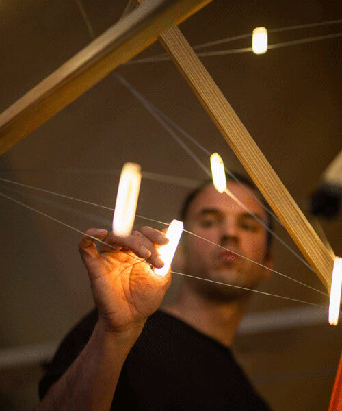sculptural tensegrity lamp strikes a luminous balance between compression and tension