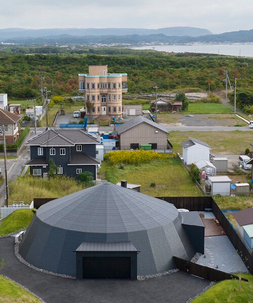 humans and cars cohabitate in this playful retreat shaped like a circus tent in japan 