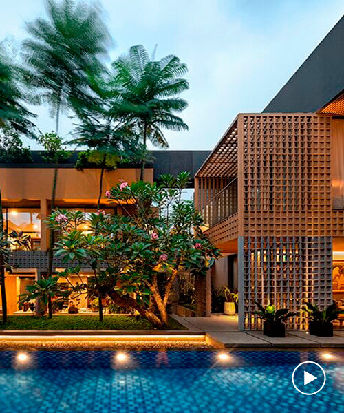 perforated grid facade skin enfolds private retreat in indonesia