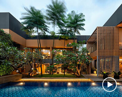 perforated grid facade skin enfolds private retreat in indonesia