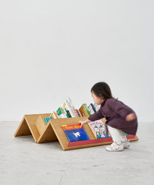 mobile bookshelf with mountain-shaped fixtures invites children to explore independently