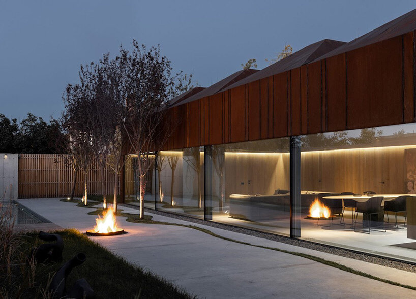 undulating concrete entrance adorns calujac architecture's family house in rural moldova