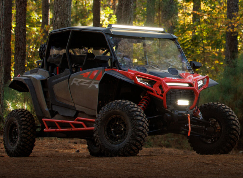 multi-terrain off-roader polaris RZR XP weathers steep hills, rough ...