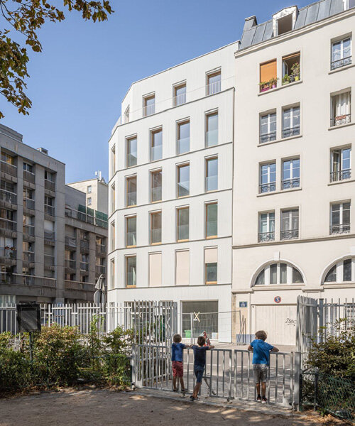 wooden residential complex reinterprets characteristic parisian suburban architecture