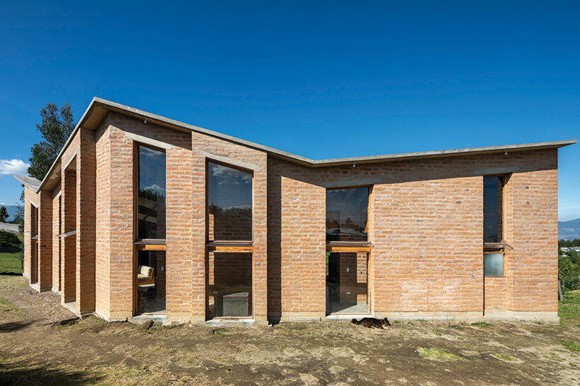 emilio lópez crowns 'casa alangasí' in ecuador with a folded tiled roof