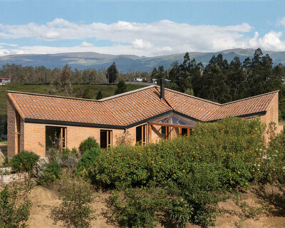 emilio lópez crowns 'casa alangasí' in ecuador with a folded tiled roof