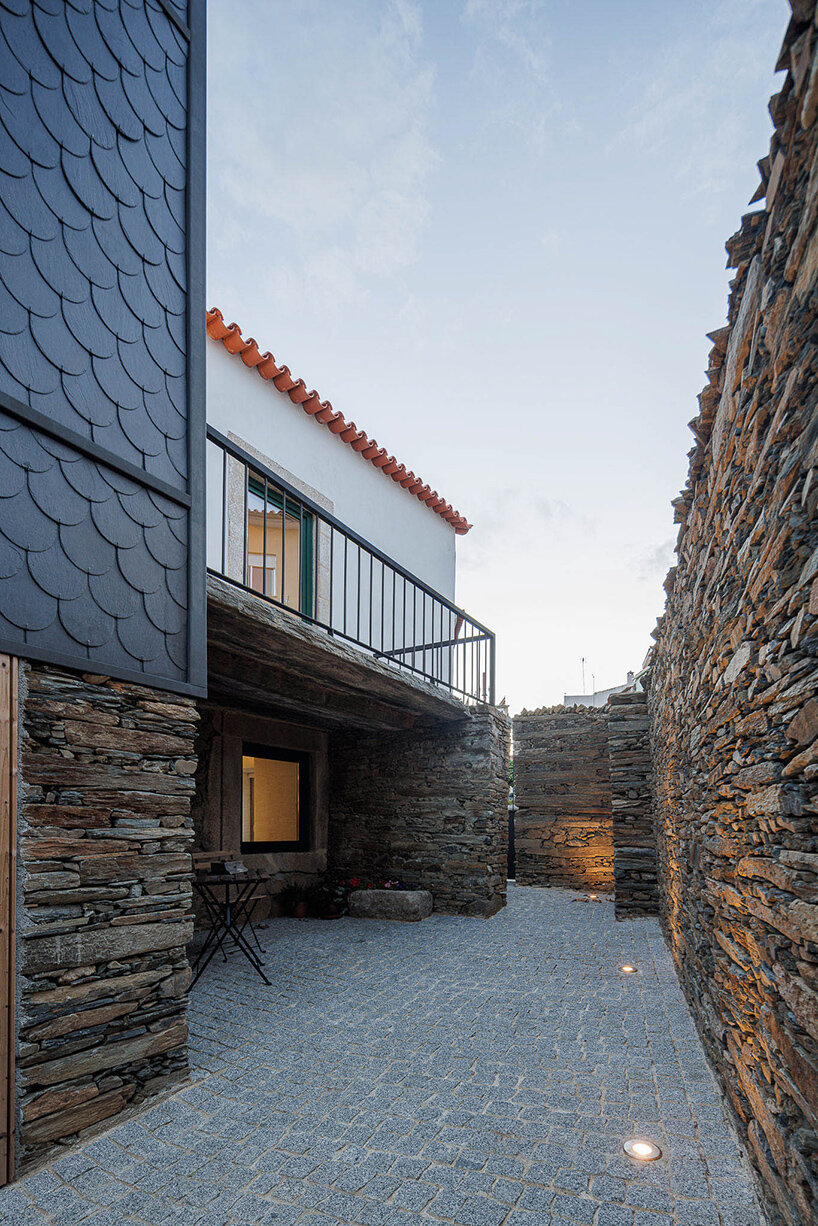 filipe pina converts 19th-century shale masonry structure into modern portuguese home