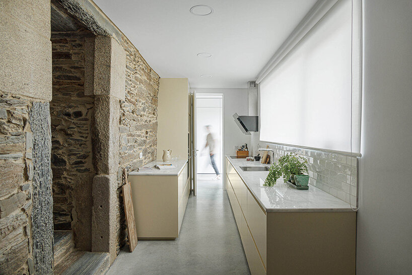 filipe pina converts 19th-century shale masonry structure into modern portuguese home