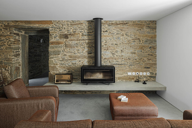 filipe pina converts 19th-century shale masonry structure into modern portuguese home