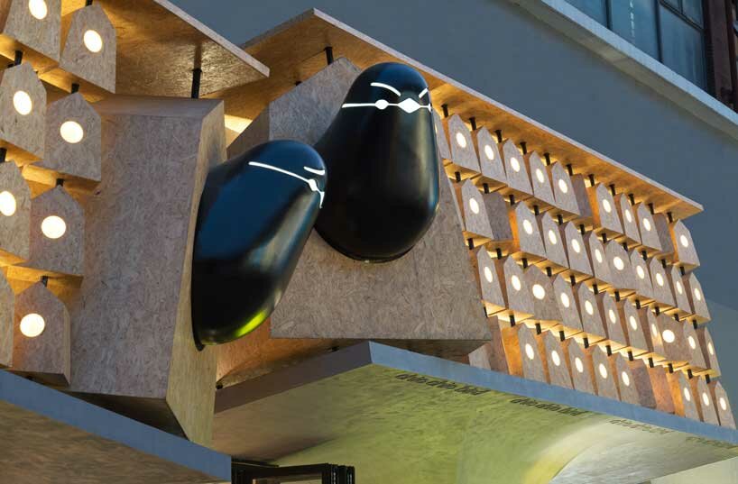 wooden roost boxes nestle on monumental columns for 'chic chic bird' noodle shop in china