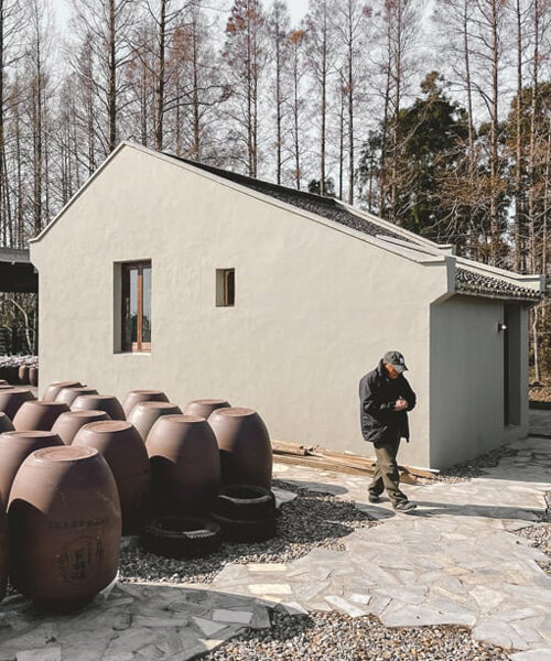 far workshop revives chinese lodge as wine cellar marked by black concrete columns