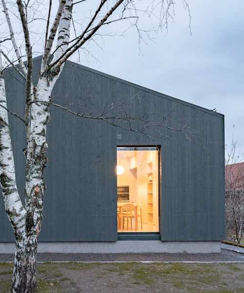 gray softwood boards contour the solid frame of 'delo house 4' in russia