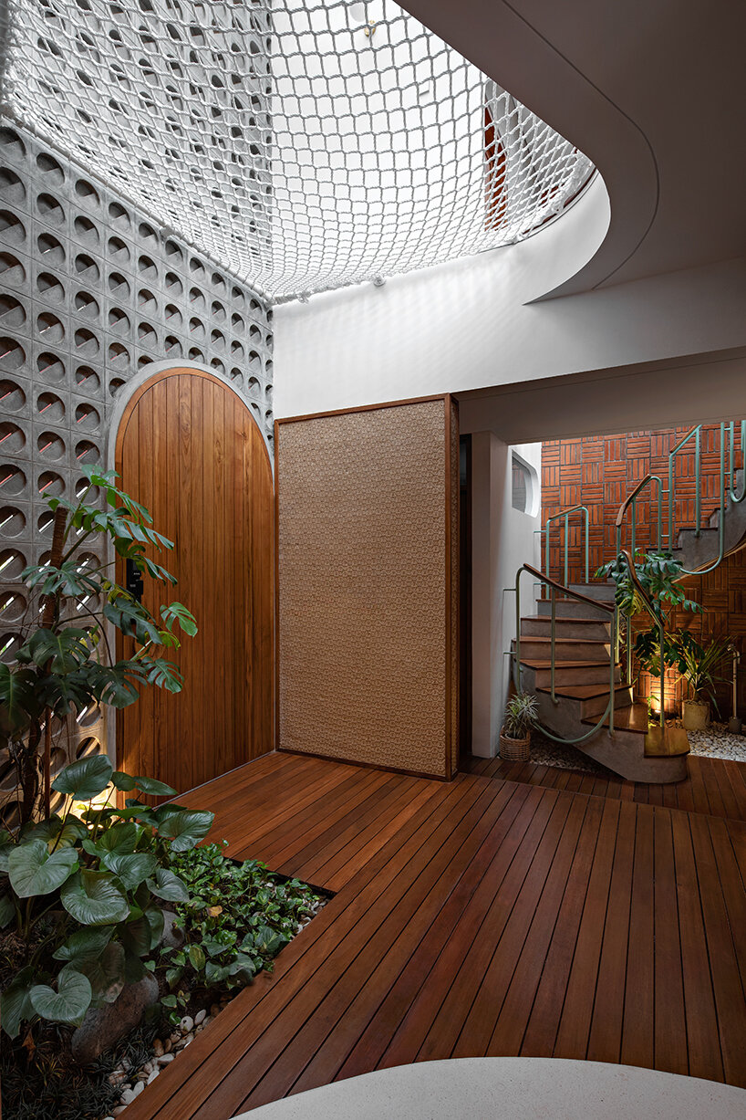 the distracted house's traditional 'joglo' roof protrudes mountain-like peaks in indonesia