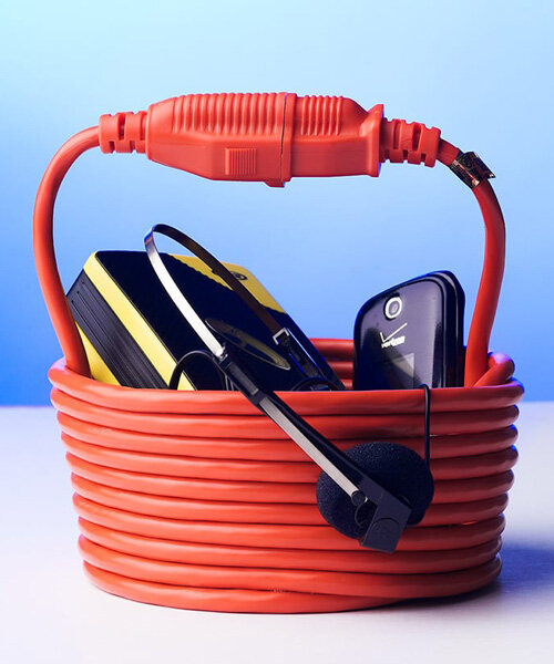 nik bentel wraps a single 25 ft electric cord into a statement bucket-shaped handbag 