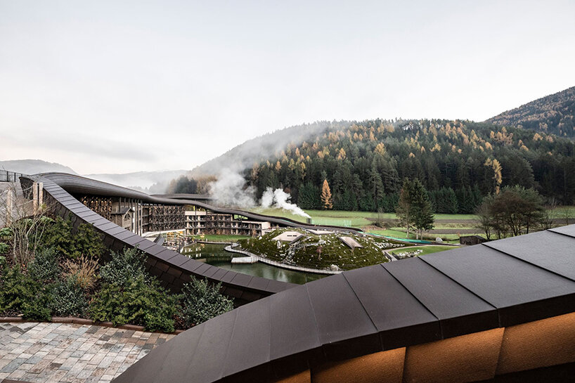 noa* uplifts historical family resort in the italian alps with playful mega-roofscape