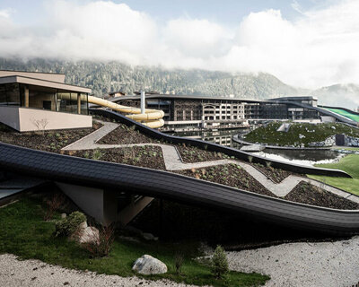 noa* uplifts historical family resort in the italian alps with playful mega-roofscape