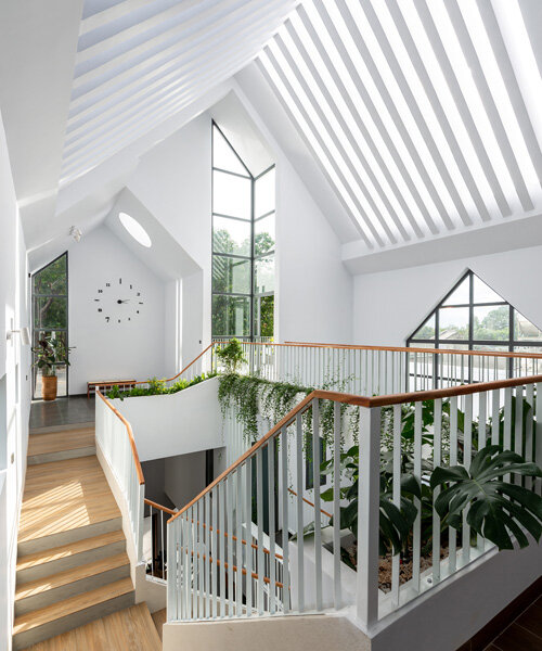 story architecture's lofty 'gather house' is flooded with sunlight in vietnam