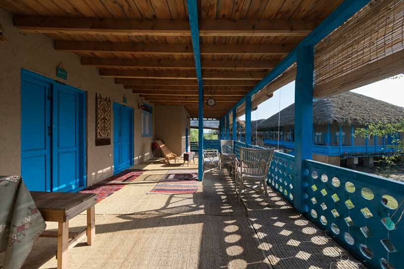 eco-lodge resort in iran stands on repurposed layered beams