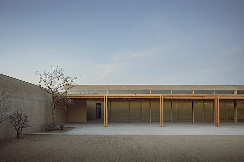 rammed earth walls envelop this new sports complex by hector barroso in mexico