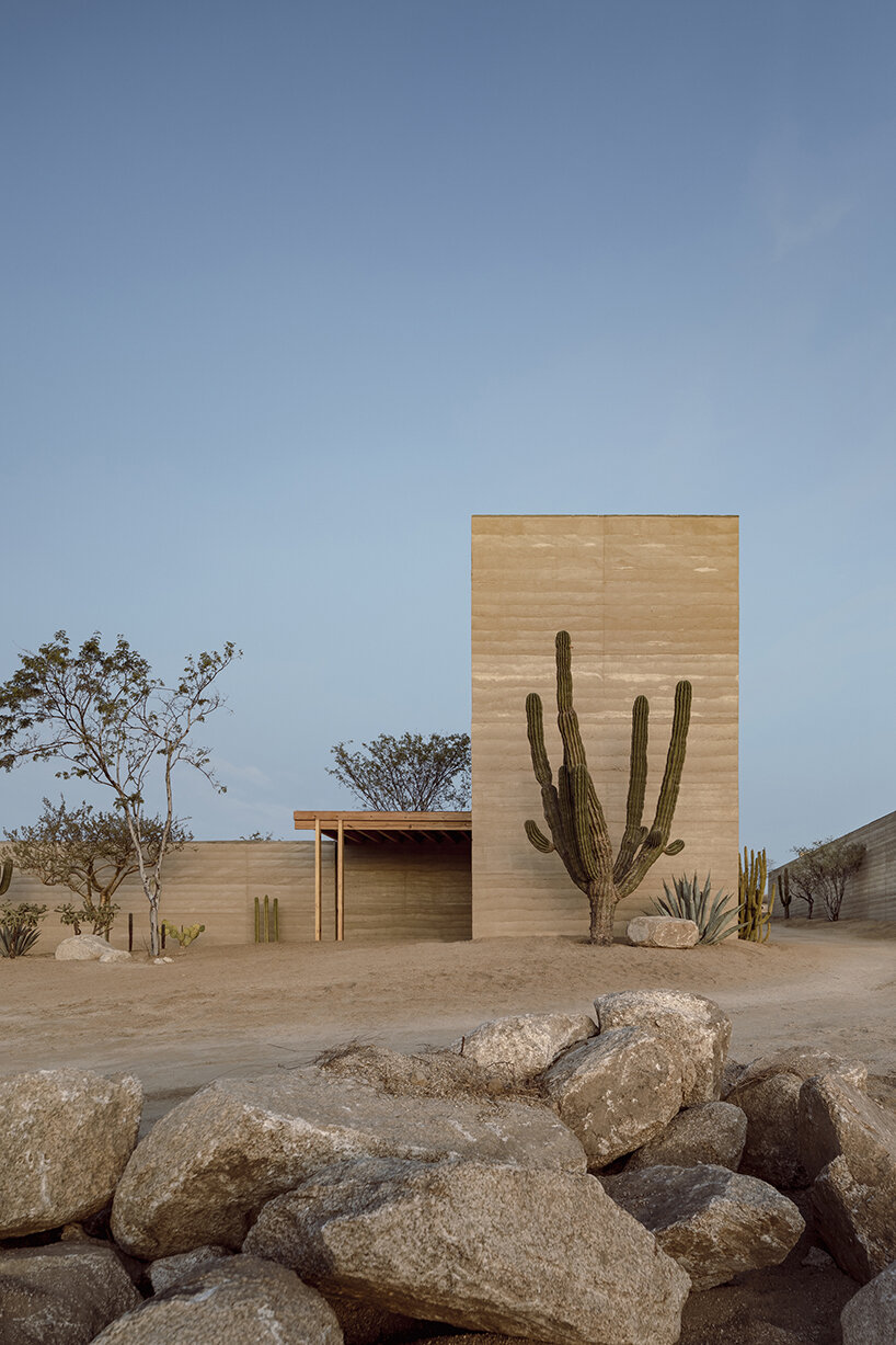 rammed earth walls envelop this new sports complex by hector barroso in mexico