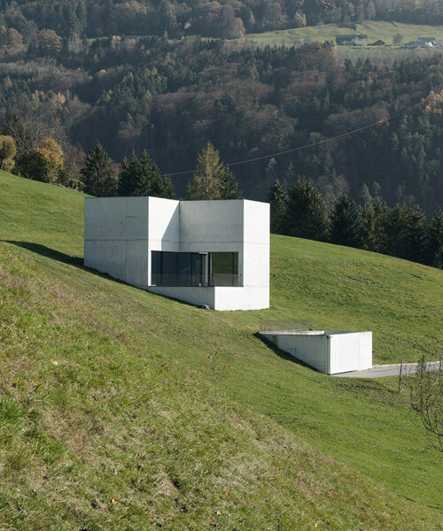 marte marte architects embeds monolithic 'house of chambers' into an austrian meadow