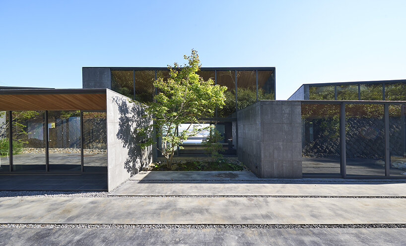 suppose design office turns sculptural blocks into meditative two-family dwelling in japan