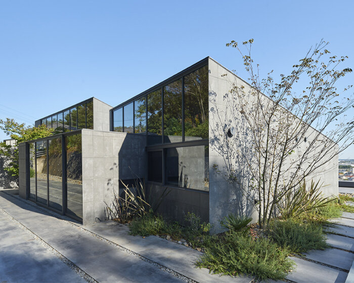 suppose design office turns sculptural blocks into private two-family dwelling in japan