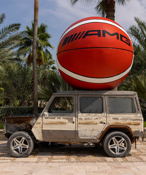 julien boudet rests giant counterfeit basketball on top of mercedes G wagon at art dubai