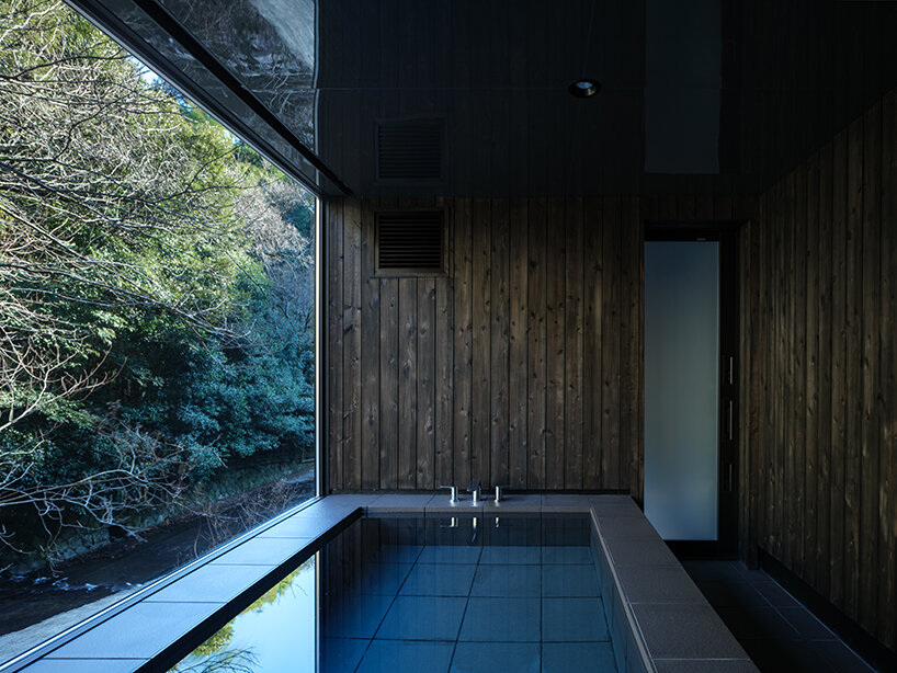 kubo tsushima architects reflects river onto mirrored hotel-spa ceiling in japan