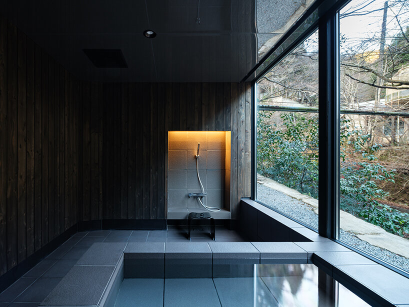 kubo tsushima architects reflects river onto mirrored hotel-spa ceiling in japan
