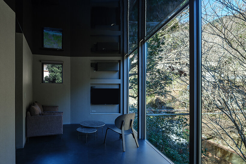 kubo tsushima architects reflects river onto mirrored hotel-spa ceiling in japan