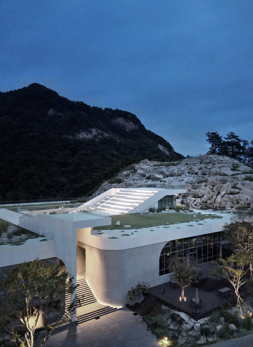 LESS architects weaves new clubhouse into the hilly landscape of wonju in south korea