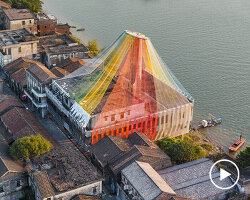 MAD architects wraps abandoned chinese landmark in ethereal veil of multicolored cloth