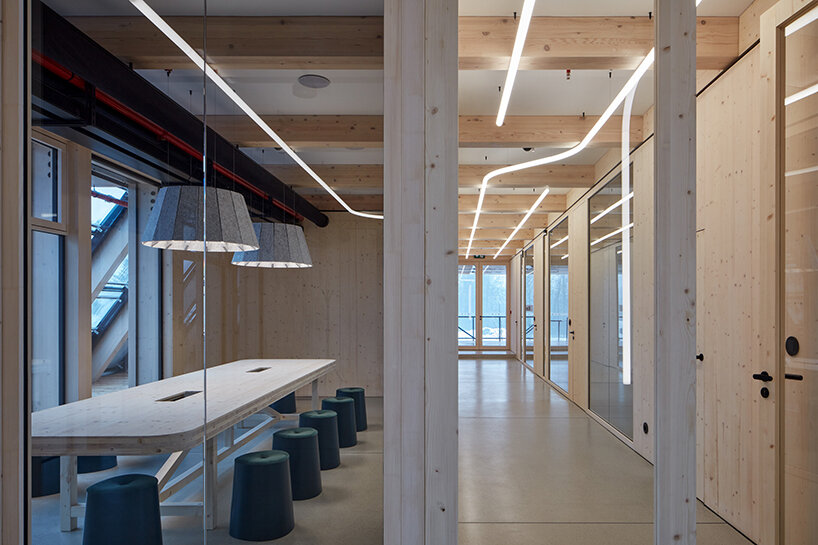 a modular timber shell envelops this new office space by mjölk architekti in czechia